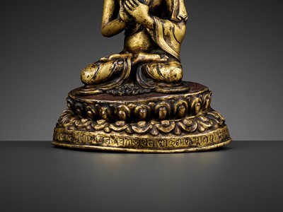 Lot 41 - A GILT BRONZE FIGURE OF A CROWNED BUDDHA, DATED 1709