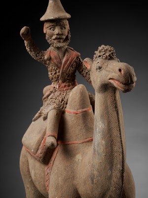 Lot 137 - A LARGE PAINTED POTTERY BACTRIAN CAMEL WITH RIDER, TANG DYNASTY