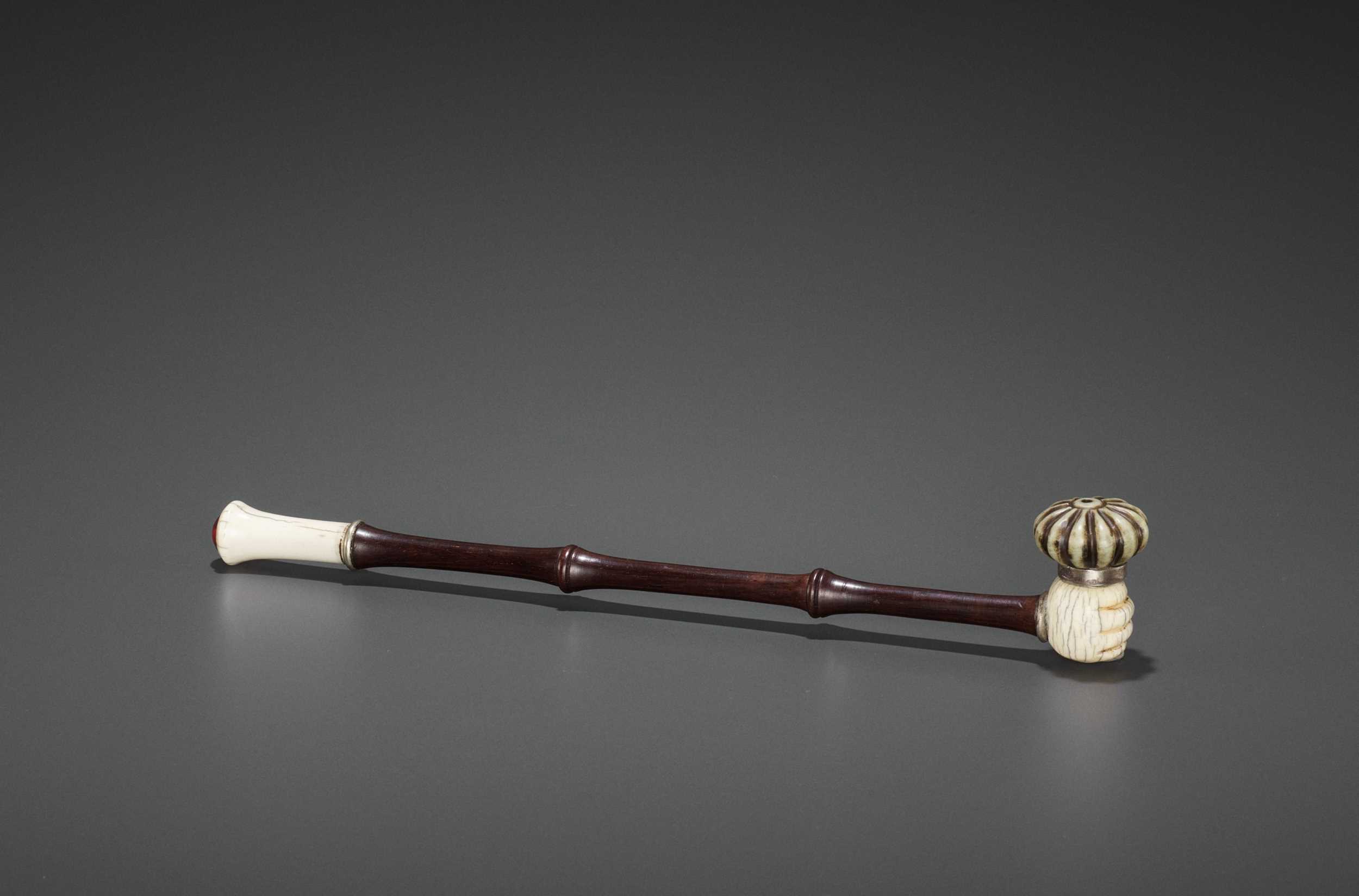 Lot 24 - A HARDWOOD OPIUM PIPE WITH IVORY, HARDSTONE AND SILVERED COPPER FITTINGS, LATE QING TO REPUBLIC