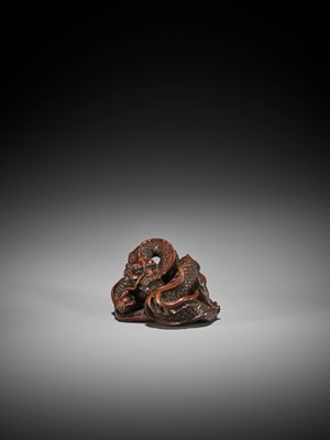 Lot 181 - SHUSEN: A POWERFUL AND LARGE WOOD NETSUKE OF A COILED DRAGON