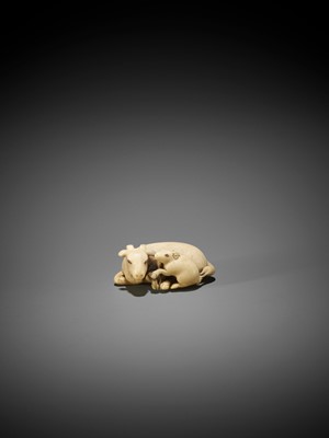 Lot 292 - TOMOKAZU: AN IVORY NETSUKE OF A GOAT WITH YOUNG