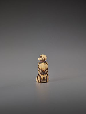 Lot 264 - A STAG ANTLER NETSUKE OF A MONKEY WITH CHESTNUT