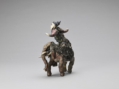 Lot 719 - A GLAZED TERRACOTTA FIGURE OF A DIGNITARY RIDING AN ELEPHANT, MID-QING