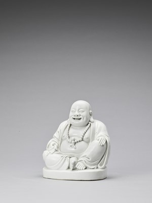 Lot 848 - A WHITE GLAZED DEHUA PORCELAIN FIGURE OF BUDAI, QING