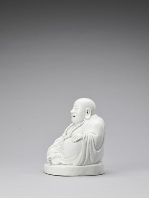 Lot 848 - A WHITE GLAZED DEHUA PORCELAIN FIGURE OF BUDAI, QING