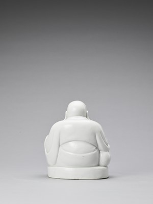 Lot 848 - A WHITE GLAZED DEHUA PORCELAIN FIGURE OF BUDAI, QING