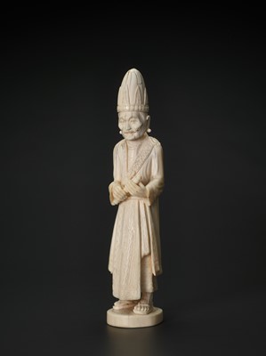 Lot 657 - A 19TH CENTURY INDO-PERSIAN IVORY SCULPTURE OF A PRIEST