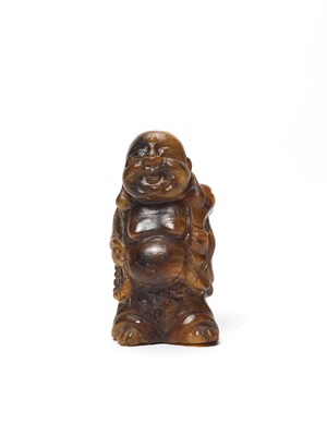 Lot 770 - A TIGER’S EYE MINIATURE CARVING OF BUDAI, QING OR REPUBLIC