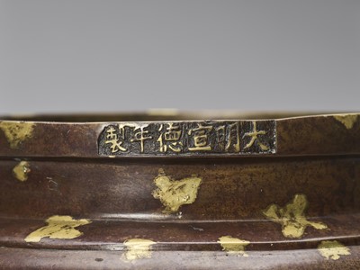 Lot 53 - A GOLD-SPLASHED BRONZE TRIPOD CENSER WITH SIX-CHARACTER XUANDE MARK, QING