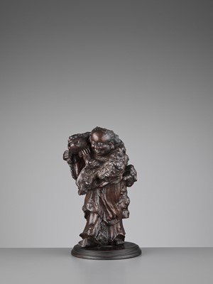 Lot 132 - A BURLWOOD CARVING OF LIU HAI, LATE MING TO EARLY QING