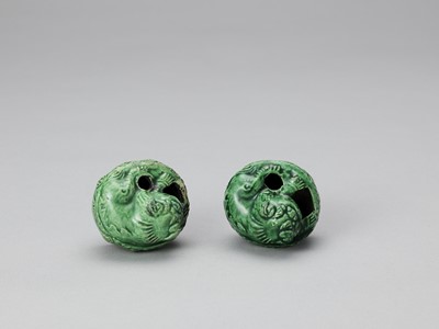 Lot 635 - A PAIR OF EMERALD GREEN GLAZED POTTERY BUDDHIST LION WATER DROPPERS, KANGXI