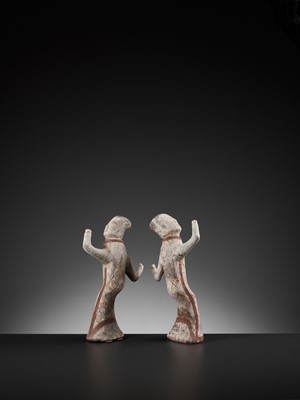 Lot 125 - A PAIR OF PAINTED POTTERY FIGURES OF DANCERS, HAN DYNASTY
