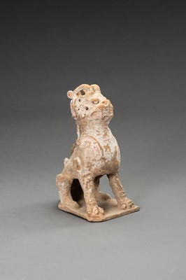 A POTTERY FIGURE OF A HORNED GUARDIAN BEAST, TANG DYNASTY OR EARLIER