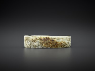 AN ARCHASITIC JADE SCABBARD SLIDE WITH DRAGON AMID CLOUDS, EARLY MING