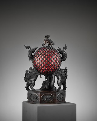 Lot 17 - A RARE TEMPLE LAMP OF BRONZE SHISHI SUPPORTING A BROCADE BALL