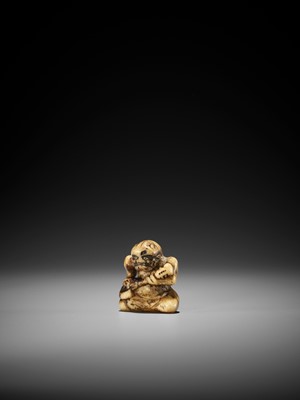 Lot 259 - AN EARLY STAG ANTLER NETSUKE OF AN ONI PLAYING THE SAMISEN