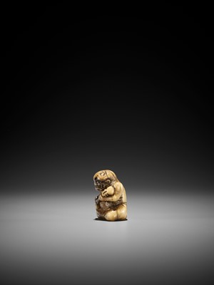 Lot 259 - AN EARLY STAG ANTLER NETSUKE OF AN ONI PLAYING THE SAMISEN