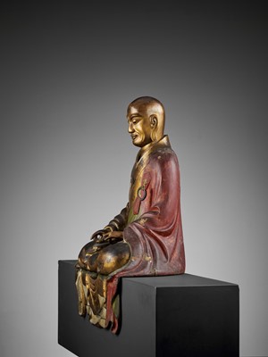 Lot 126 - AN IMPORTANT GILT AND LACQUERED WOOD FIGURE OF A RAKAN