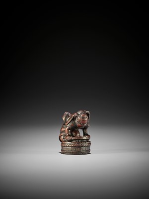 Lot 397 - A WOOD NETSUKE OF SHOKI CAPTURING ONI