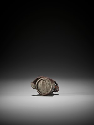 Lot 397 - A WOOD NETSUKE OF SHOKI CAPTURING ONI
