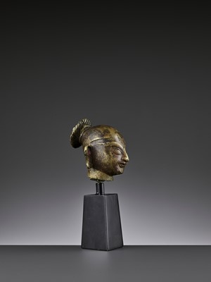 Lot 750 - AN INDIAN GILT BRONZE HEAD OF DURGA