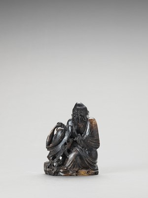 Lot 764 - A LARGE SOAPSTONE CARVING DEPICTING SHOULAO WITH DRAGON, LATE QING