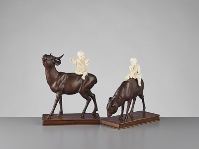 Lot 84 - TOSHIYUKI: A PAIR OF WOOD AND IVORY OKIMONO WITH BOYS ON DEER