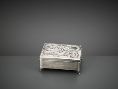 Lot 10 - A SILVER REPOUSSE ‘DRAGON’ BOX AND COVER, WANG HING, LATE QING TO REPUBLIC