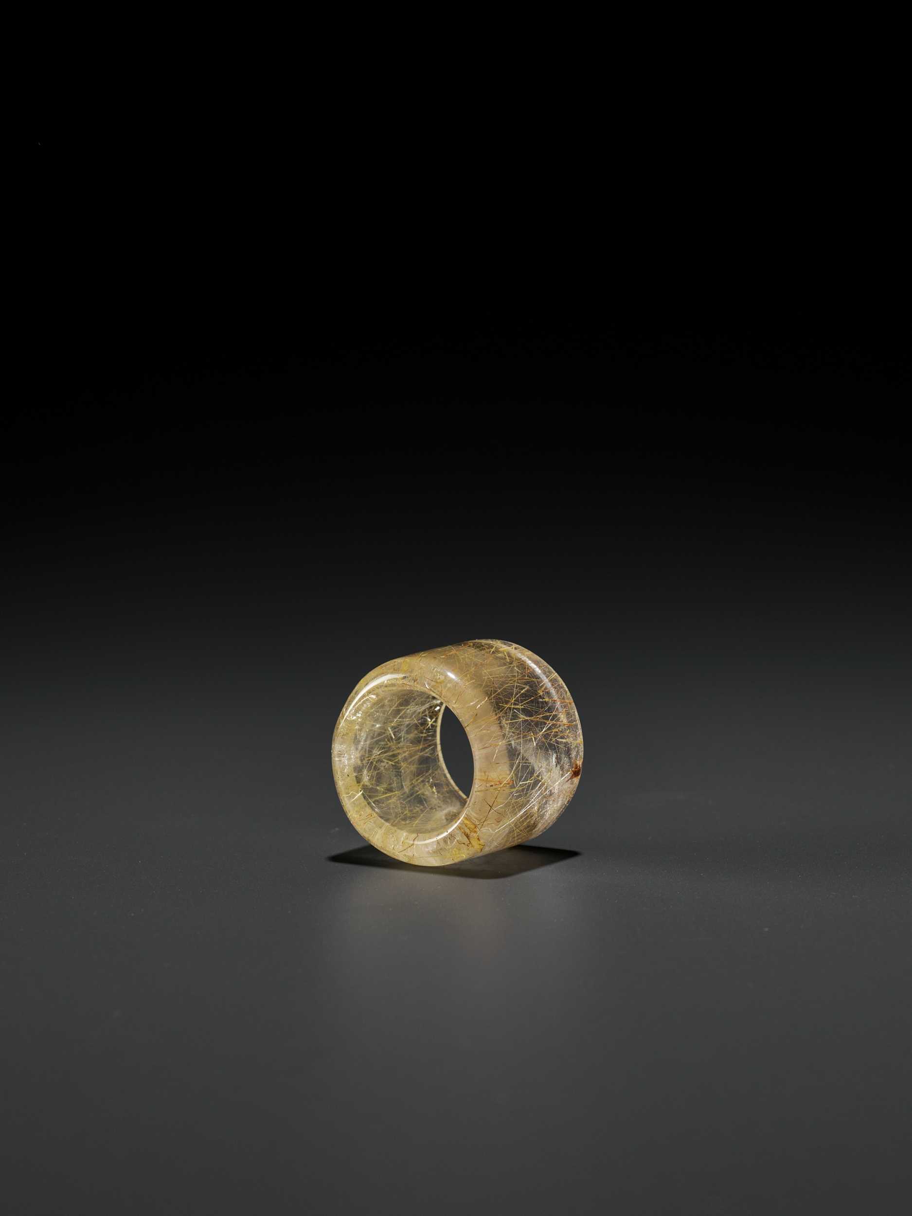 Lot 46 - A ‘HAIR’ CRYSTAL ARCHER’S RING, QING DYNASTY