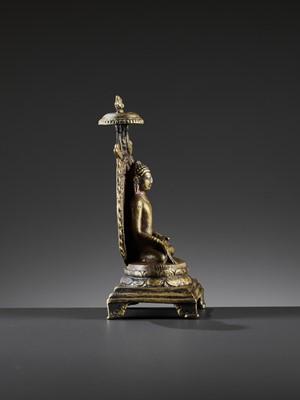 Lot 982 - AN INDIAN BRONZE FIGURE OF RATNASAMBHAVA, PALA PERIOD STYLE