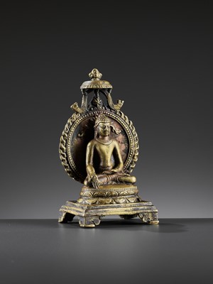 Lot 982 - AN INDIAN BRONZE FIGURE OF RATNASAMBHAVA, PALA PERIOD STYLE