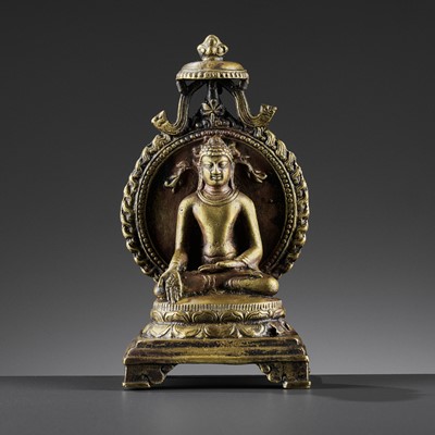 Lot 982 - AN INDIAN BRONZE FIGURE OF RATNASAMBHAVA, PALA PERIOD STYLE