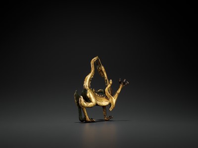 Lot 428 - A RARE GILT BRONZE FIGURE OF A DRAGON, TANG DYNASTY