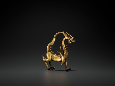 Lot 428 - A RARE GILT BRONZE FIGURE OF A DRAGON, TANG DYNASTY