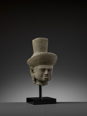 Lot 705 - AN IMPORTANT SANDSTONE HEAD OF SHIVA, ANGKOR WAT STYLE