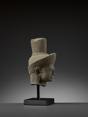 Lot 705 - AN IMPORTANT SANDSTONE HEAD OF SHIVA, ANGKOR WAT STYLE