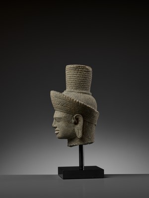 Lot 705 - AN IMPORTANT SANDSTONE HEAD OF SHIVA, ANGKOR WAT STYLE