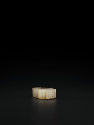 Lot 102 - A WHITE AND RUSSET JADE MINIATURE ARCHAISTIC VASE, LATE MING TO MID-QING