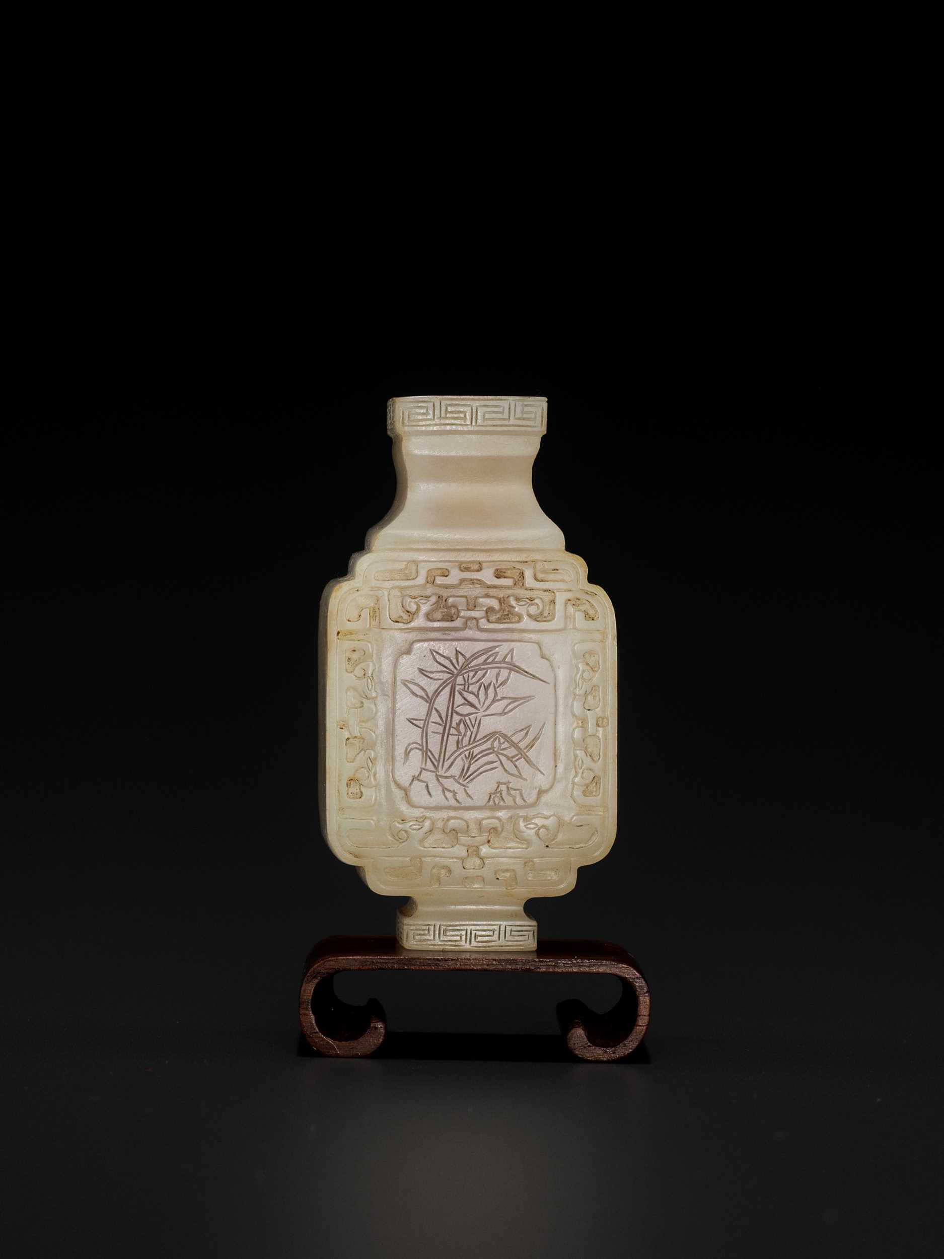 Lot 102 - A WHITE AND RUSSET JADE MINIATURE ARCHAISTIC VASE, LATE MING TO MID-QING