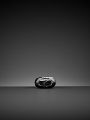 Lot 349 - A BLACK AND WHITE JADE ‘SEEKING SHELTER’ SNUFF BOTTLE, ‘MASTER OF THE ROCKS’ SCHOOL, QING DYNASTY