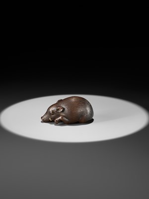 Lot 144 - RANJO: A SUPERB AND RARE WOOD NETSUKE OF A RECUMBENT BOAR