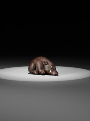 Lot 144 - RANJO: A SUPERB AND RARE WOOD NETSUKE OF A RECUMBENT BOAR