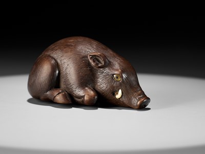 Lot 144 - RANJO: A SUPERB AND RARE WOOD NETSUKE OF A RECUMBENT BOAR