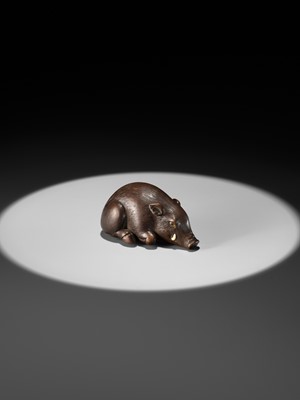 Lot 144 - RANJO: A SUPERB AND RARE WOOD NETSUKE OF A RECUMBENT BOAR