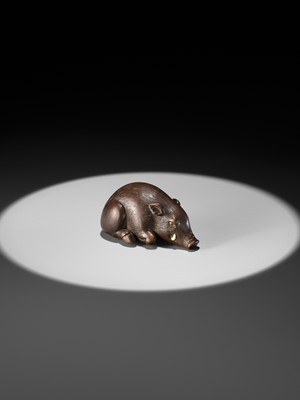 Lot 144 - RANJO: A SUPERB AND RARE WOOD NETSUKE OF A RECUMBENT BOAR