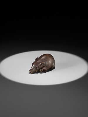 Lot 144 - RANJO: A SUPERB AND RARE WOOD NETSUKE OF A RECUMBENT BOAR