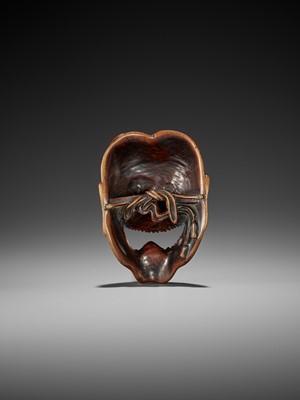 Lot 84 - A SPECTACULAR AND LARGE WOOD MASK NETSUKE OF A FEMALE DEMON