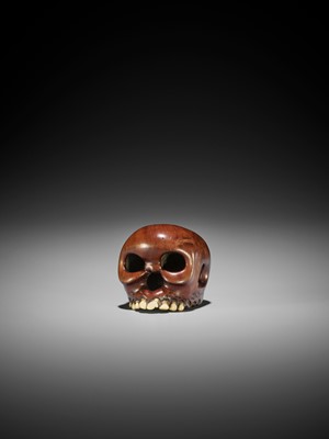 Lot 127 - IKKAN: A WOOD AND STAG ANTLER NETSUKE OF A SKULL