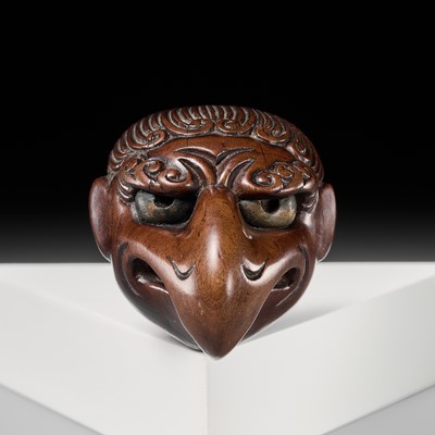 Lot 294 - DEME UMAN: A SUPERB WOOD MASK NETSUKE OF KARASU TENGU