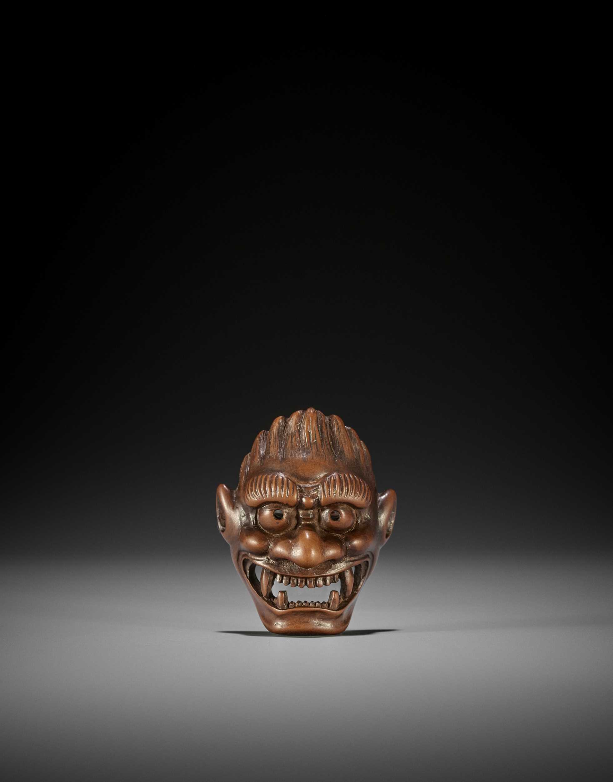 Lot 288 - DEME UMAN: A RARE WOOD MASK NETSUKE OF FUJIN
